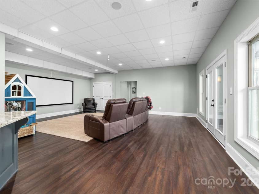 404 Yorkfield Drive, Shelby, NC 28150.  MLS# CAR4205572, YatesRealty ID 9353. Second Den area with movie screen and plenty of room for larger gatherings.  Access to grilling patio.
