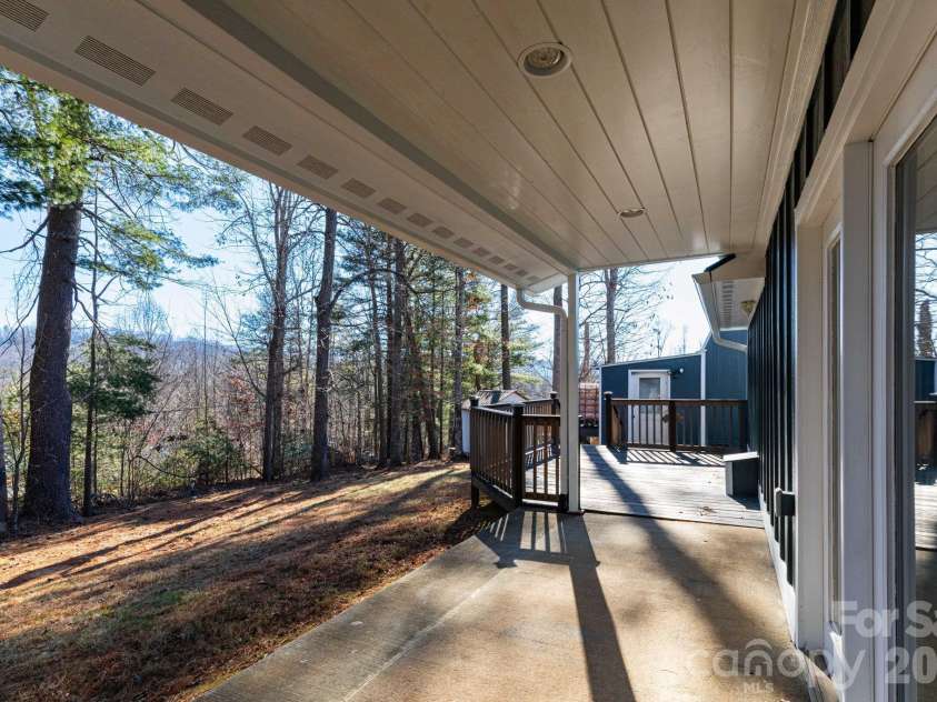 7 McGee Ridge Road, Fairview, NC 28730.  MLS# CAR4327576, YatesRealty ID 9362. Covered back porch.