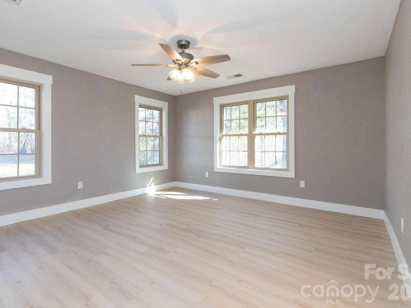 7 McGee Ridge Road, Fairview, NC 28730.  MLS# CAR4327576, YatesRealty ID 9362. Primary bedroom with tons of natural lighting. 