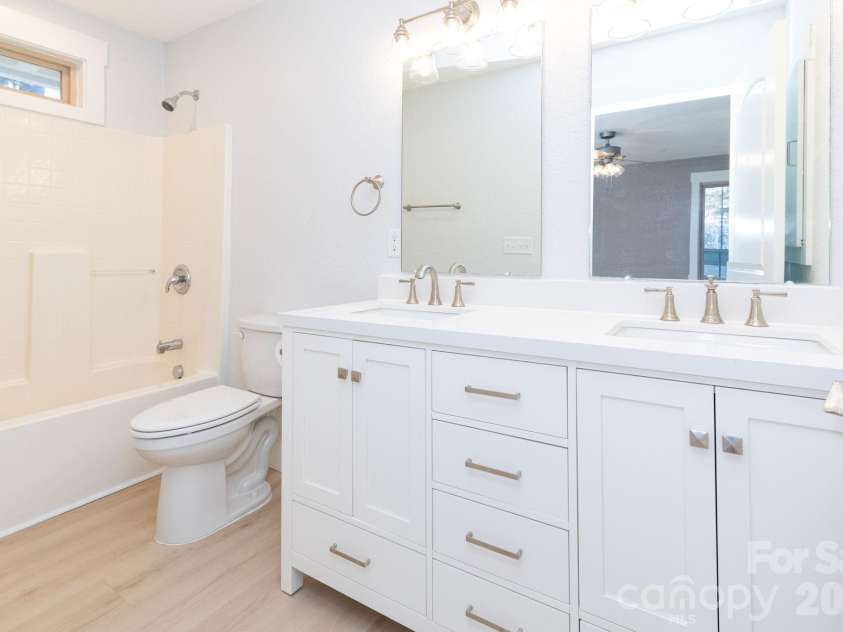 7 McGee Ridge Road, Fairview, NC 28730.  MLS# CAR4327576, YatesRealty ID 9362. Primary en suite with double vanities. 