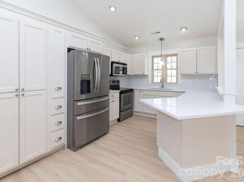 7 McGee Ridge Road, Fairview, NC 28730.  MLS# CAR4327576, YatesRealty ID 9362. Sparkling Ice Quartz countertops. 