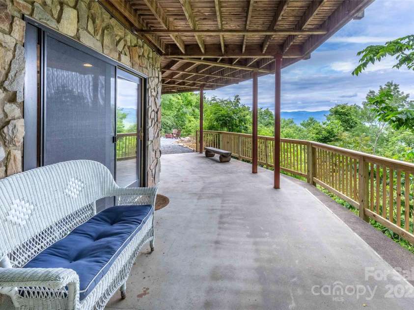 278 Talisi Trail, Whittier, NC 28789.  MLS# CAR4240743, YatesRealty ID 9363. Patio off lower living room