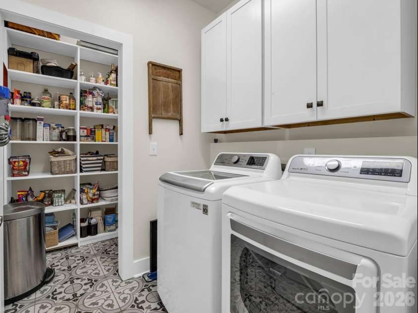 52 Old Spring Drive, Candler, NC 28715.  MLS# CAR4360930, YatesRealty ID 9363. Laundry room with walk-in pantry