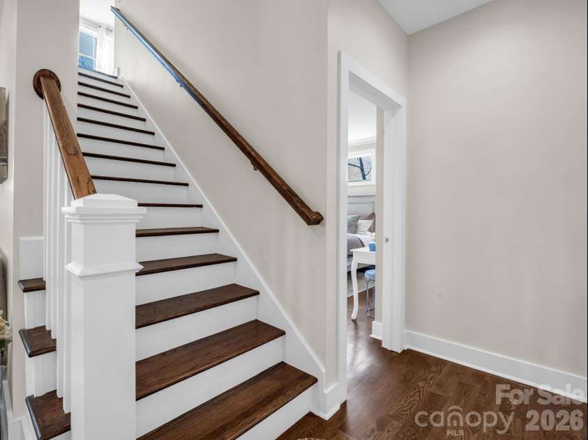 52 Old Spring Drive, Candler, NC 28715.  MLS# CAR4360930, YatesRealty ID 9363. White oak stairs leading to loft