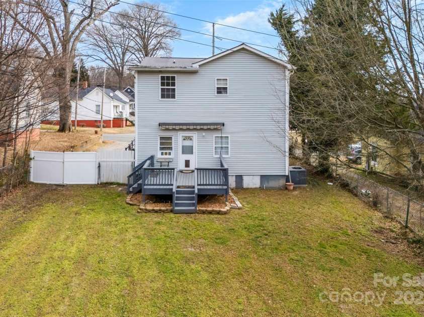 590 Main Street, Concord, NC 28027.  MLS# CAR4222529, YatesRealty ID 9367. Back Deck with an electric sun shade