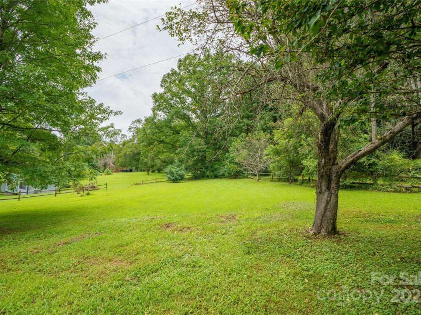 45 Armstrong Road, Etowah, NC 28729.  MLS# CAR4276177, YatesRealty ID 9369. Large yard with wooden fence