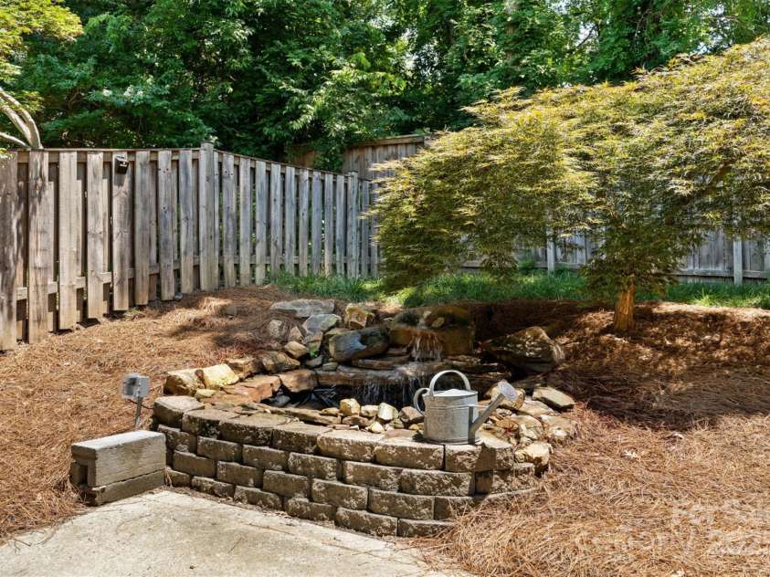 2620 Merion Hills Court, Charlotte, NC 28269.  MLS# CAR4274977, YatesRealty ID 9372. Beautiful Pond with Waterfall