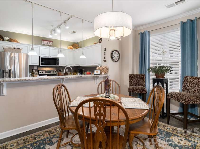 714 Northeast Drive, Davidson, NC 28036.  MLS# CAR4349837, YatesRealty ID 9377. End unit provides extra windows in the dining area.