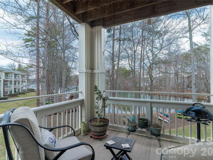 714 Northeast Drive, Davidson, NC 28036.  MLS# CAR4349837, YatesRealty ID 9377. End unit provides views of the Lake while relaxing.