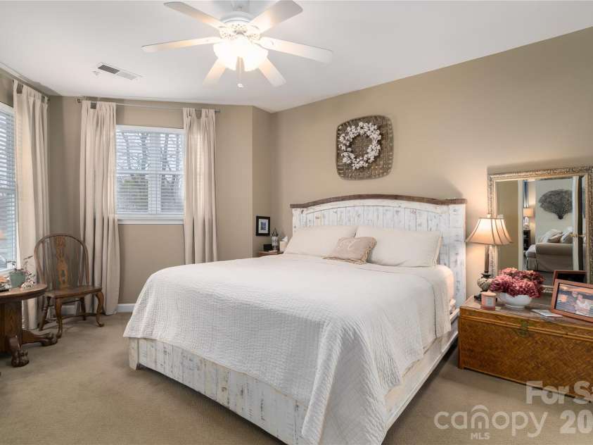 714 Northeast Drive, Davidson, NC 28036.  MLS# CAR4349837, YatesRealty ID 9377. Large Primany Bedroom has extra windows and ceiling fan.