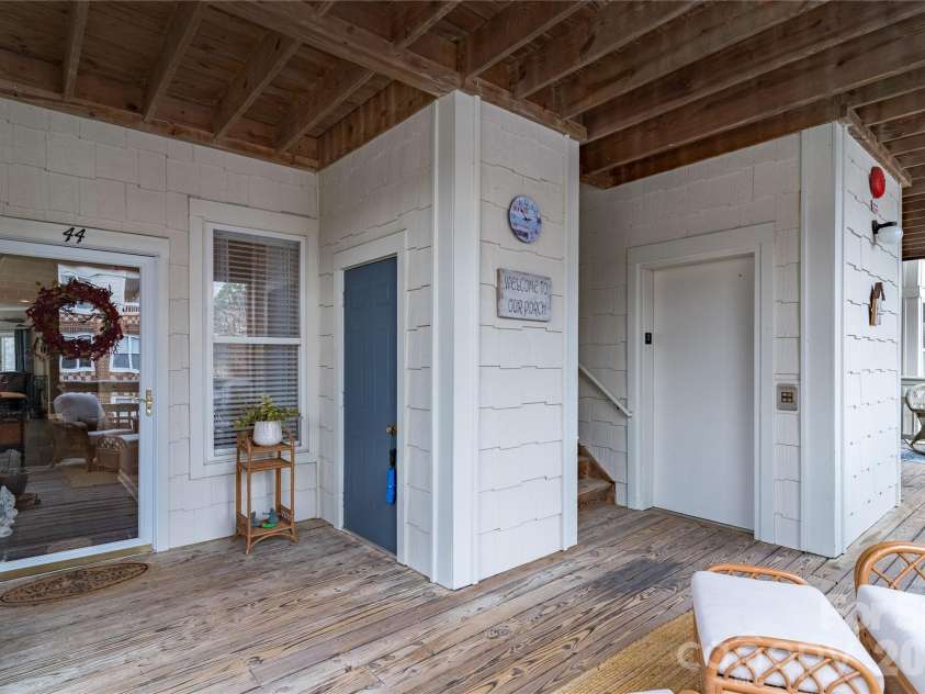 714 Northeast Drive, Davidson, NC 28036.  MLS# CAR4349837, YatesRealty ID 9377. Storm door, storage closet and elevator.