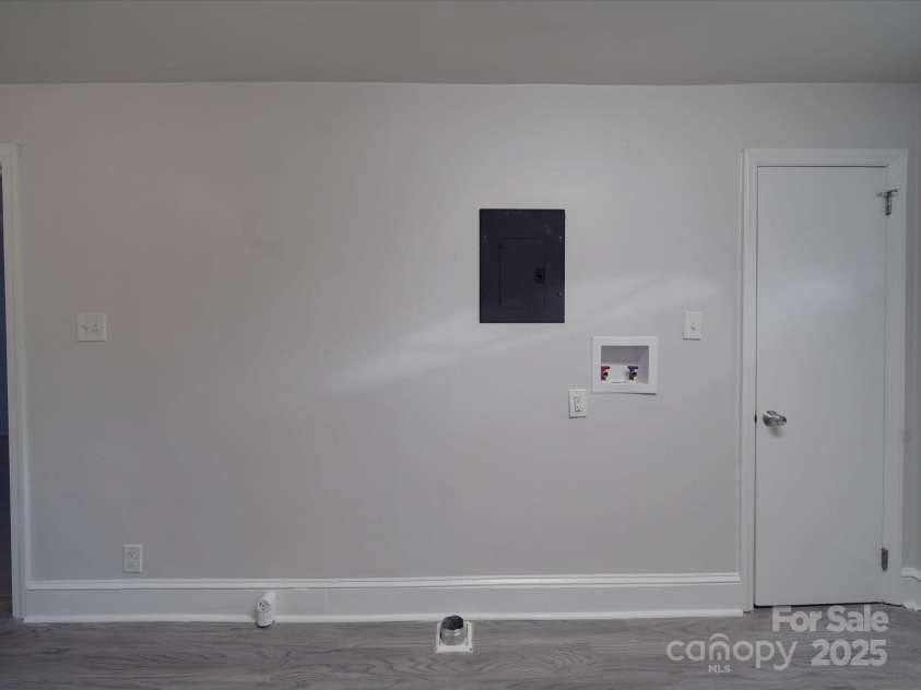 2996 Shady Lane, Charlotte, NC 28208.  MLS# CAR4208360, YatesRealty ID 9379. Laundry in kitchen