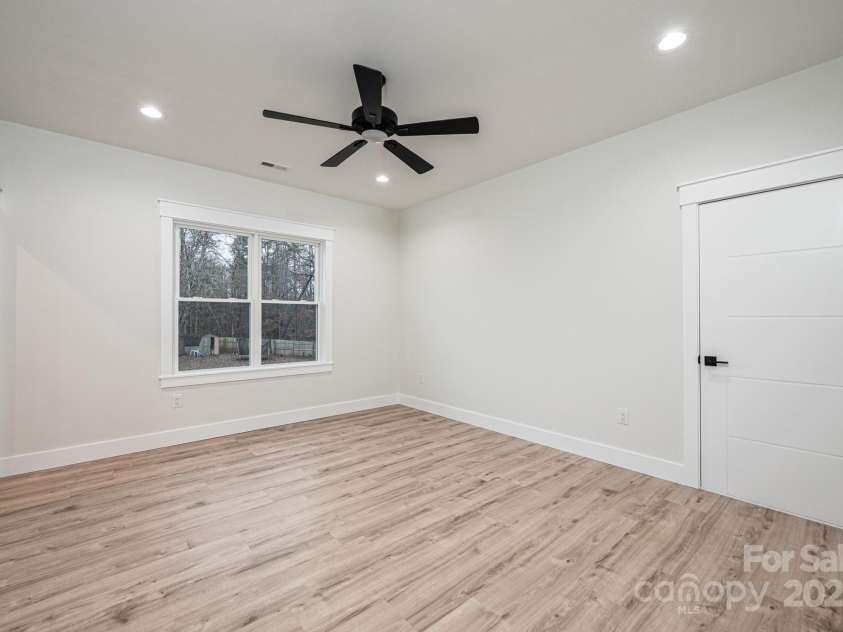 1328 33rd Avenue Drive, Hickory, NC 28601.  MLS# CAR4327859, YatesRealty ID 938. Bedroom #4 with Large Walk in Closet and Ceiling Fan, Upstairs, Back Right, Walk in Attic Access. Large Floored Attic Storage Space. 