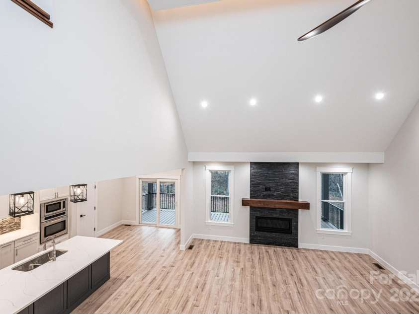 1328 33rd Avenue Drive, Hickory, NC 28601.  MLS# CAR4327859, YatesRealty ID 938. Looking down from the upstairs level to the Kitchen, Breakfast Area and 2 Story Great Room with Fireplace.