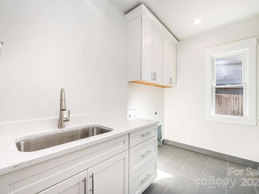 1328 33rd Avenue Drive, Hickory, NC 28601.  MLS# CAR4327859, YatesRealty ID 938. Main Level Laundry complete with overhead cabinets and Full size Sink and Cabinets