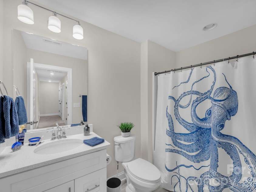 112 Sugar Hill Road, Troutman, NC 28166.  MLS# CAR4337757, YatesRealty ID 9384. Guest Bath with quartz vanity & Tile Floor