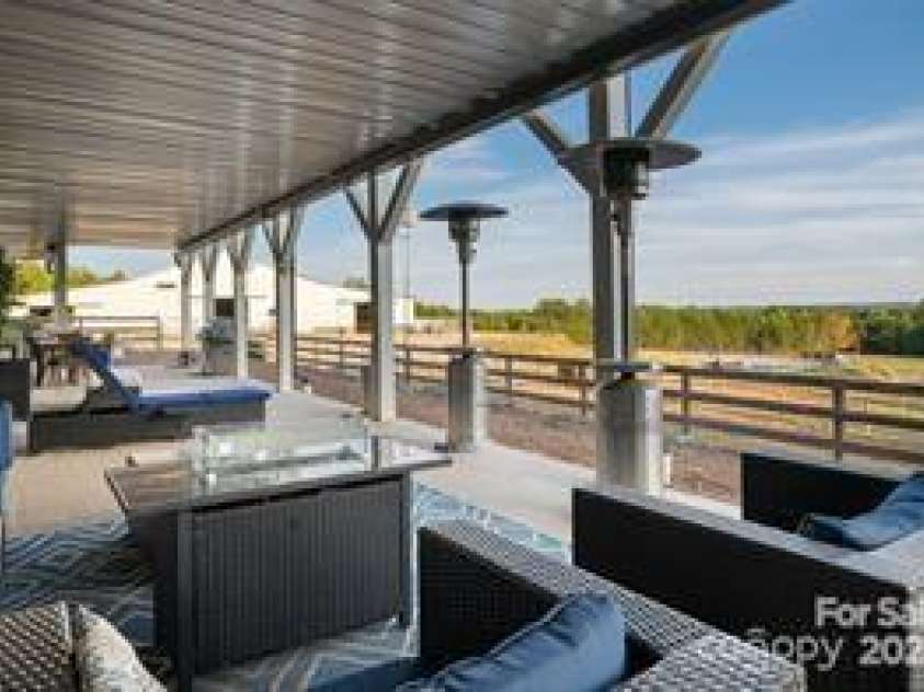 822 & 920 Preservation Trail, Columbus, NC 28722.  MLS# CAR4223854, YatesRealty ID 9386. Ground floor back patio outdoor living space