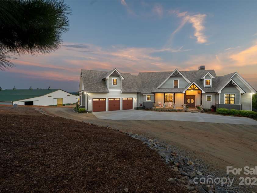 822 & 920 Preservation Trail, Columbus, NC 28722.  MLS# CAR4223854, YatesRealty ID 9386. House with barn on the left
