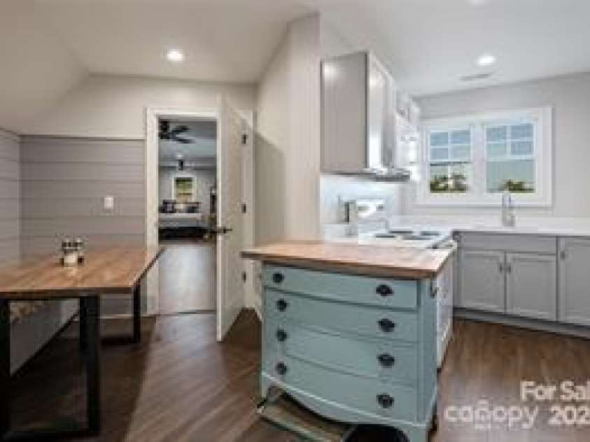 822 & 920 Preservation Trail, Columbus, NC 28722.  MLS# CAR4223854, YatesRealty ID 9386. Main house garage apartment kitchen and dining