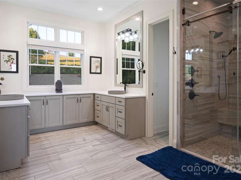 822 & 920 Preservation Trail, Columbus, NC 28722.  MLS# CAR4223854, YatesRealty ID 9386. Main primary ensuite bathroom with luxury steam shower