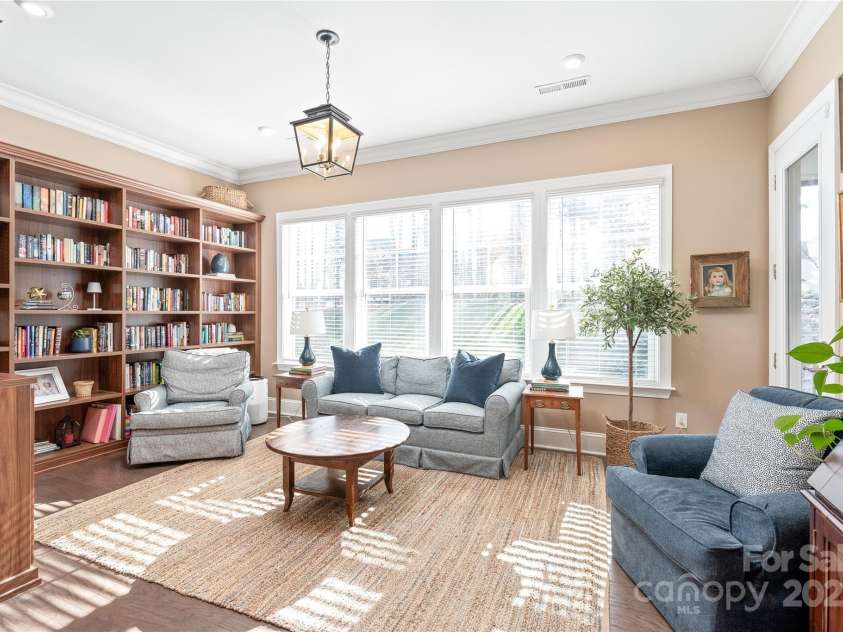 128 Shimmer Lake Lane, Belmont, NC 28012.  MLS# CAR4208573, YatesRealty ID 9390. A bright retreat! The sunroom off the great room is flooded with natural light, featuring custom California Closet shelving and easy access to the screened-in porch.