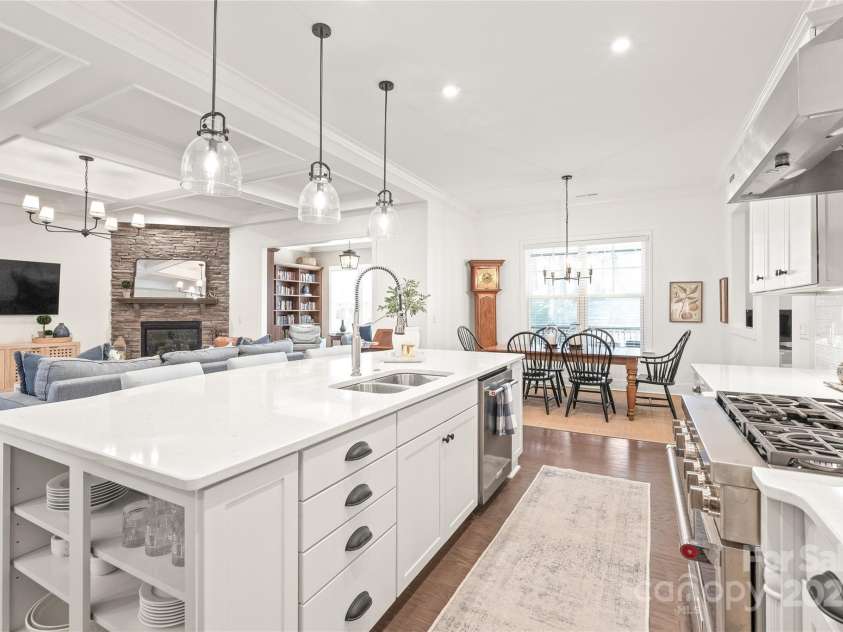 128 Shimmer Lake Lane, Belmont, NC 28012.  MLS# CAR4208573, YatesRealty ID 9390. A touch of elegance! Designer open shelves on either side of the island add both style and functionality to this gourmet kitchen.