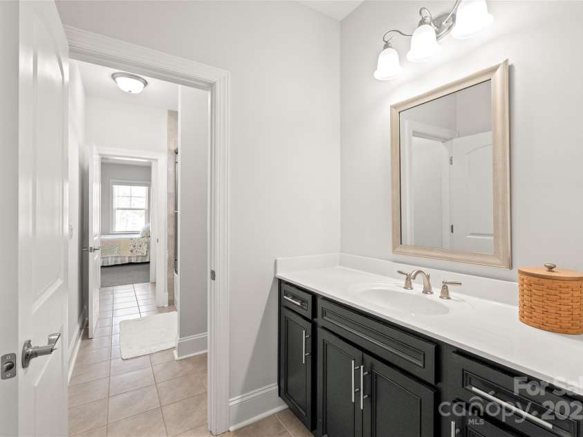 128 Shimmer Lake Lane, Belmont, NC 28012.  MLS# CAR4208573, YatesRealty ID 9390. Bedroom 4 includes its own sink and shares a tub/shower with Bedroom 3 in the Jack and Jill bathroom, providing the perfect balance of privacy and convenience.
