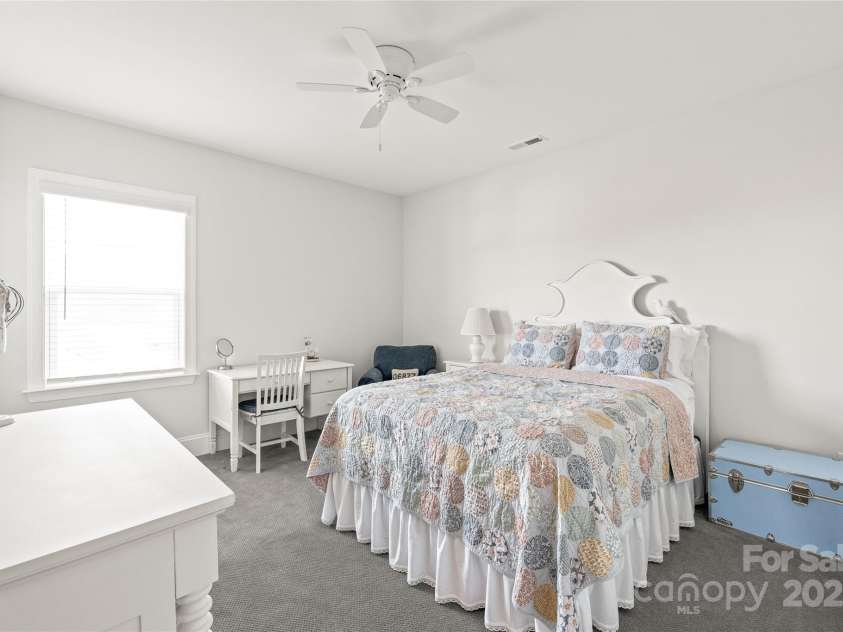 128 Shimmer Lake Lane, Belmont, NC 28012.  MLS# CAR4208573, YatesRealty ID 9390. Bedroom 4 offers a spacious walk-in closet and convenient Jack and Jill access, combining comfort and functionality.