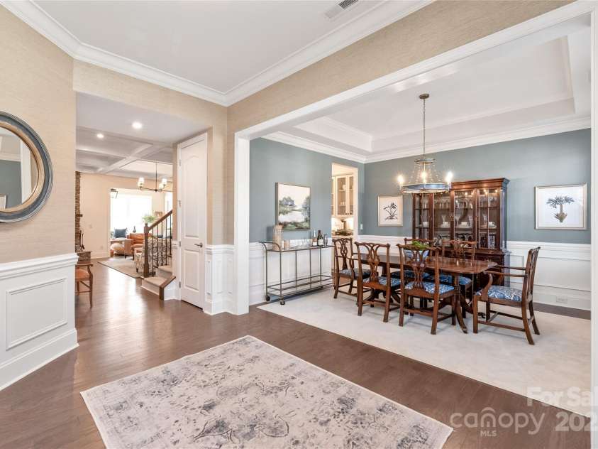 128 Shimmer Lake Lane, Belmont, NC 28012.  MLS# CAR4208573, YatesRealty ID 9390. Dine in style! The formal dining room features a stunning tray ceiling & elegant wainscoting, perfect for every occasion.