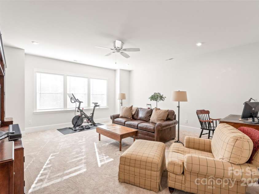 128 Shimmer Lake Lane, Belmont, NC 28012.  MLS# CAR4208573, YatesRealty ID 9390. Endless possibilities! The spacious bonus room offers the perfect space for a home theater, playroom, or creative retreat.