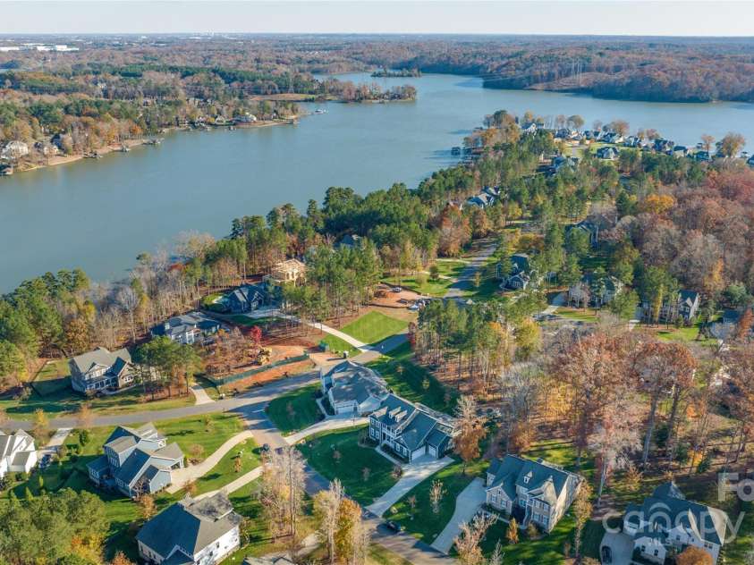 128 Shimmer Lake Lane, Belmont, NC 28012.  MLS# CAR4208573, YatesRealty ID 9390. Just a stone's throw away from Lake Wylie, enjoy all the advantages of lakeside living—stunning views, water activities, and a peaceful retreat.