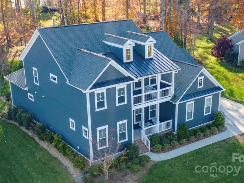 128 Shimmer Lake Lane, Belmont, NC 28012.  MLS# CAR4208573, YatesRealty ID 9390. Nestled among mature trees and just seconds away from Lake Wylie, enjoy the natural beauty and peaceful seclusion that only time and nature can provide.