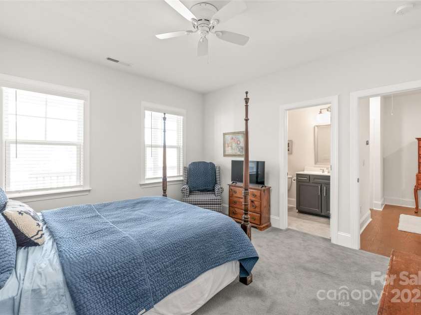 128 Shimmer Lake Lane, Belmont, NC 28012.  MLS# CAR4208573, YatesRealty ID 9390. Perfect for guests or family! Bedroom 2 features a private full bathroom and a walk-in closet, offering both comfort and convenience.