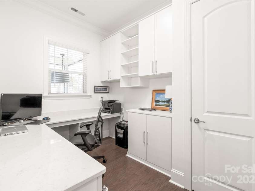 128 Shimmer Lake Lane, Belmont, NC 28012.  MLS# CAR4208573, YatesRealty ID 9390. Stay organized in style! The pocket office features custom California Closet cabinets for smart storage, plus a spacious closet for all your extra essentials.