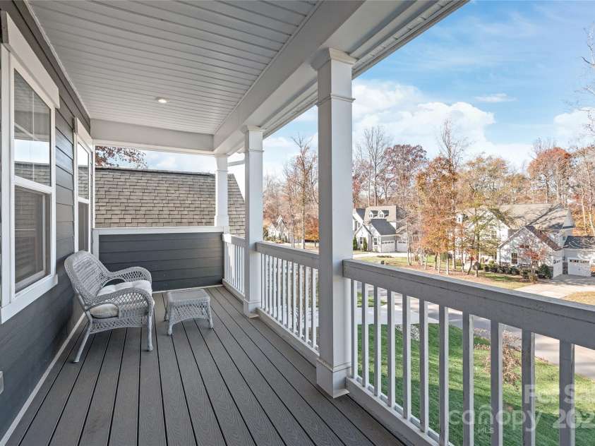 128 Shimmer Lake Lane, Belmont, NC 28012.  MLS# CAR4208573, YatesRealty ID 9390. Step outside to your covered balcony off Bedroom 3 and enjoy peaceful views—perfect for morning coffee or evening relaxation.