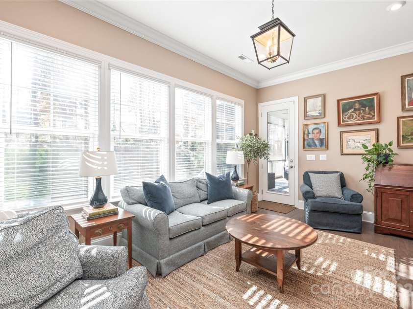 128 Shimmer Lake Lane, Belmont, NC 28012.  MLS# CAR4208573, YatesRealty ID 9390. The sunroom offers the perfect space to relax, read, or entertain, with abundant natural light and a seamless connection to the outdoors.