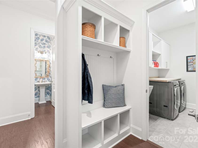 128 Shimmer Lake Lane, Belmont, NC 28012.  MLS# CAR4208573, YatesRealty ID 9390. Thoughtful design at its best! The powder bathroom, drop zone, and spacious laundry room offer both convenience and style, making everyday tasks a breeze.