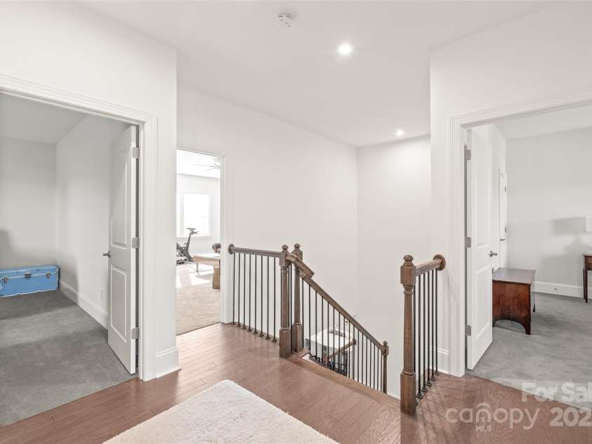 128 Shimmer Lake Lane, Belmont, NC 28012.  MLS# CAR4208573, YatesRealty ID 9390. Upstairs, you'll find 3 spacious bedrooms plus a bonus room, with a covered balcony off Bedroom 3—perfect for relaxation.