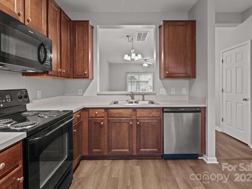 3553 Calpella Court, Charlotte, NC 28262.  MLS# CAR4220749, YatesRealty ID 9401. Kitchen opens to other main living areas