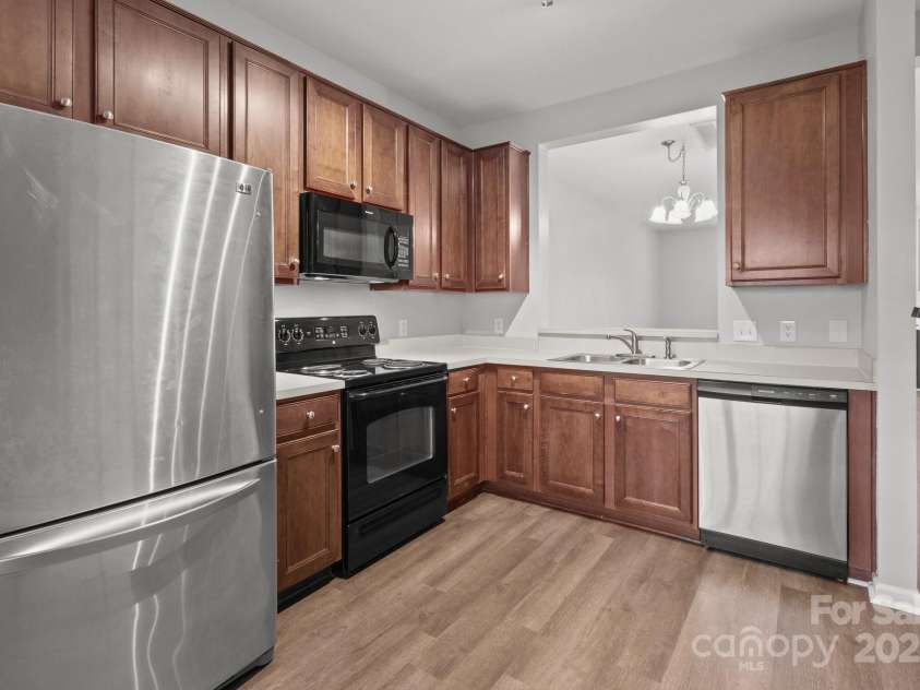 3553 Calpella Court, Charlotte, NC 28262.  MLS# CAR4220749, YatesRealty ID 9401. Kitchen sink with window to dining area