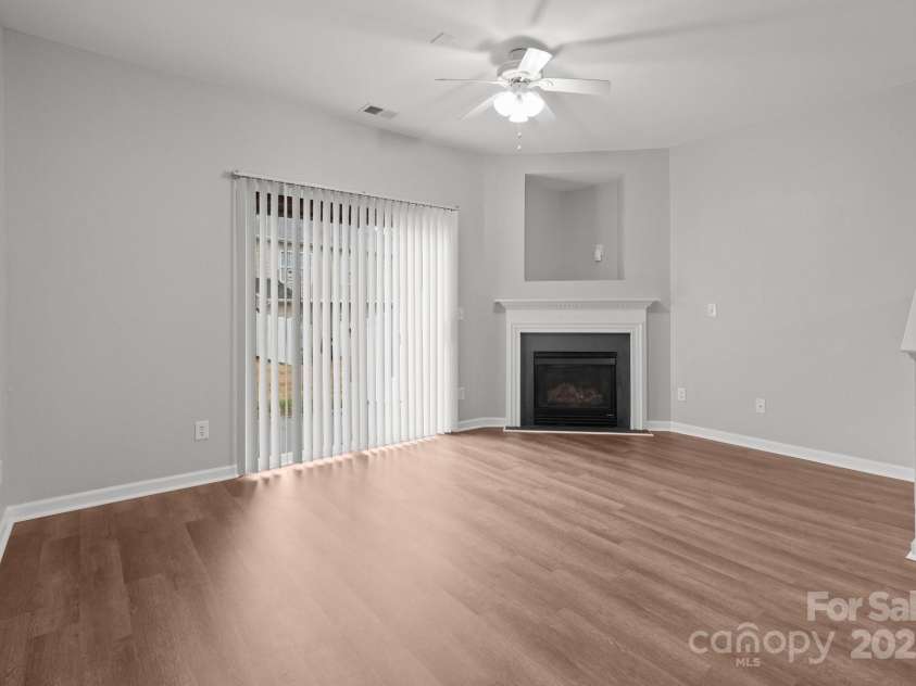3553 Calpella Court, Charlotte, NC 28262.  MLS# CAR4220749, YatesRealty ID 9401. Living room with gas fireplace