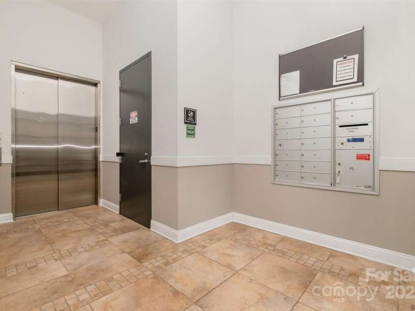 3920 Sharon Road, Charlotte, NC 28211.  MLS# CAR4225091, YatesRealty ID 9402. Main Level Entry - Elevator & Mailboxes