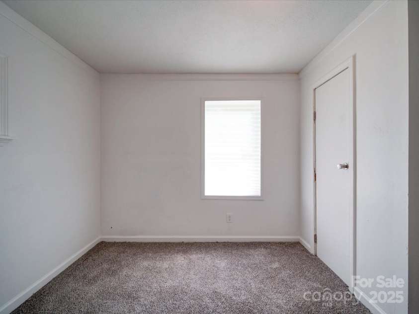 2300 Kennesaw Drive, Charlotte, NC 28216.  MLS# CAR4240575, YatesRealty ID 9406. Bedroom off of kitchen/dining area