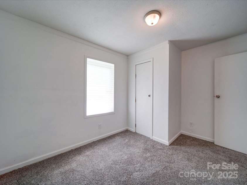 2300 Kennesaw Drive, Charlotte, NC 28216.  MLS# CAR4240575, YatesRealty ID 9406. Bedroom off of kitchen/dining area