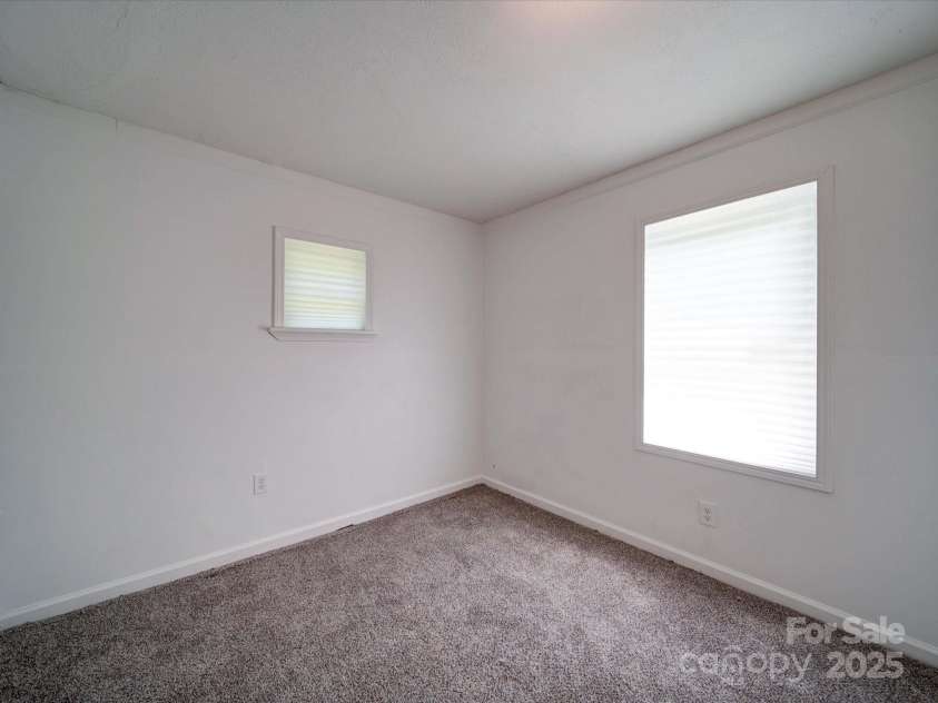 2300 Kennesaw Drive, Charlotte, NC 28216.  MLS# CAR4240575, YatesRealty ID 9406. Bedroom off of kitchen/dining area
