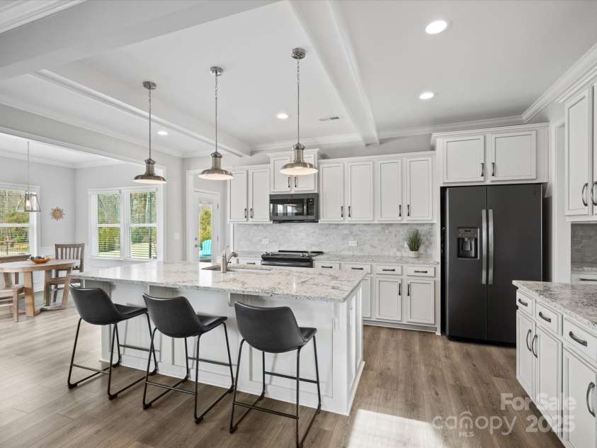 1503 Brooksland Place, Waxhaw, NC 28173.  MLS# CAR4213626, YatesRealty ID 9415. Open concept kitchen with coffered ceiling