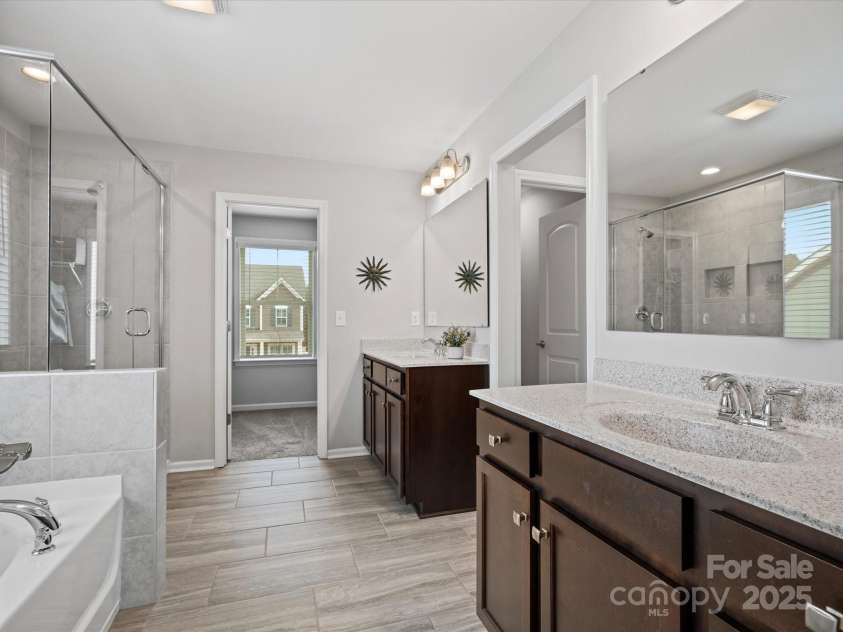 1503 Brooksland Place, Waxhaw, NC 28173.  MLS# CAR4213626, YatesRealty ID 9415. Primary Bath with dual vanity, walk-in shower, oversized jacuzzi tub, and walk-closet