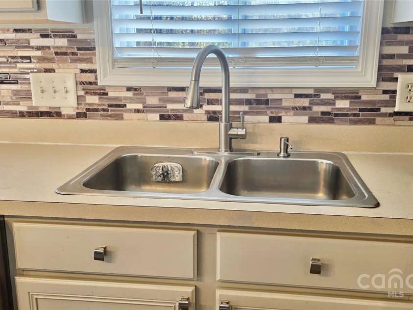10337 Hugue Way, Charlotte, NC 28214.  MLS# CAR4226522, YatesRealty ID 9422. Brand new installed Kitchen faucet and dishsoap disposal