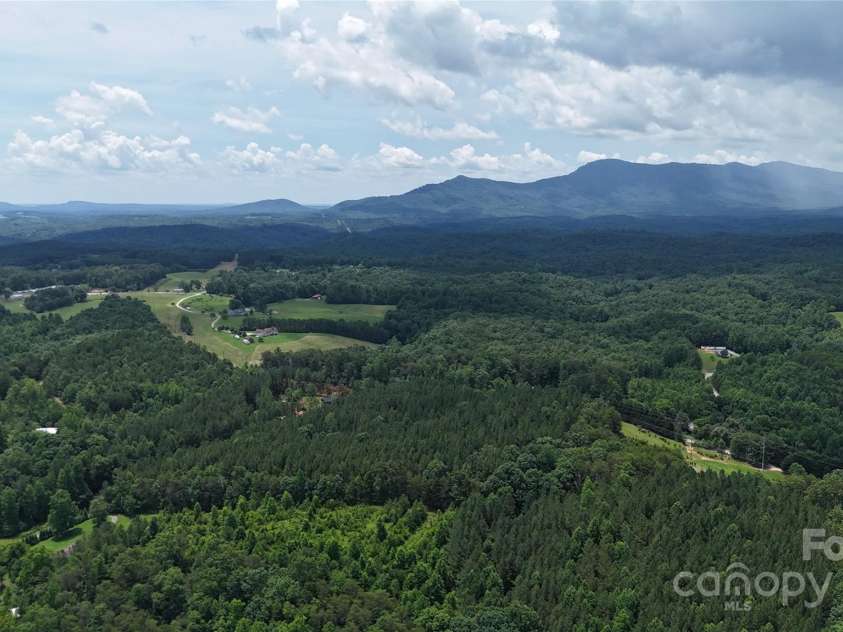 221 Flat Branch Trail, Mill Spring, NC 28756.  MLS# CAR4271037, YatesRealty ID 9427. Drone shot while directly above this Home!