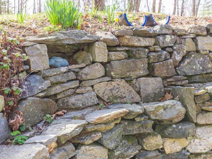 14 Woods Drive, Fairview, NC 28730.  MLS# CAR4223729, YatesRealty ID 9429. Cool rock work all around the house.